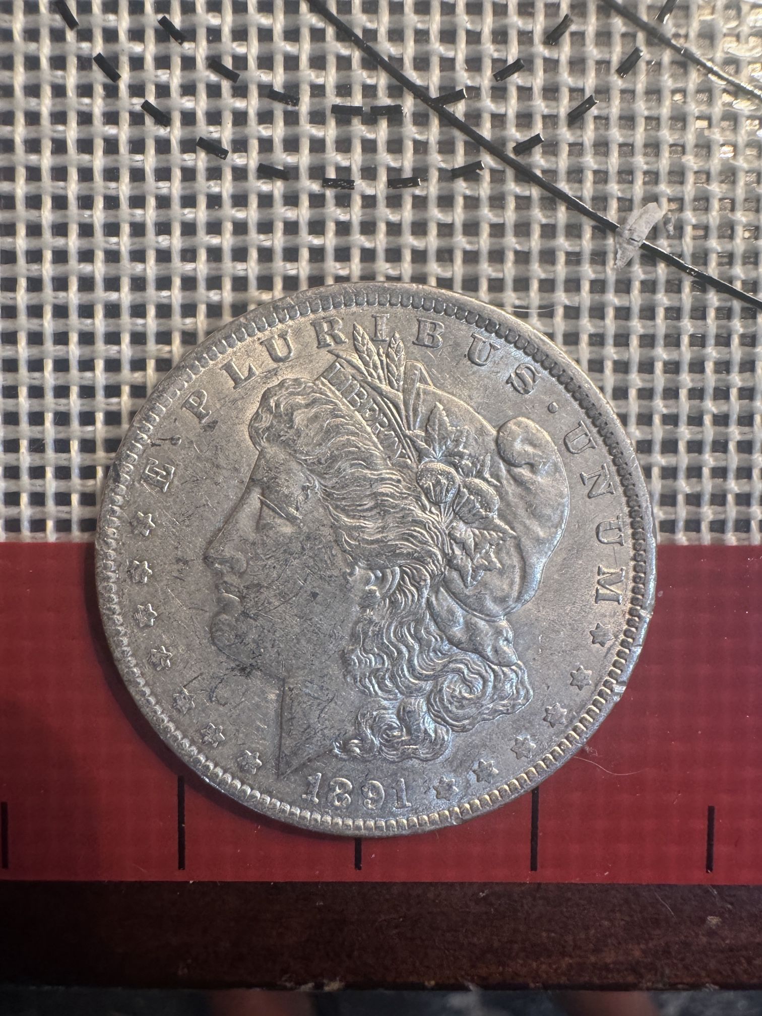 This is an 1891 Morgan Silver Dollar.