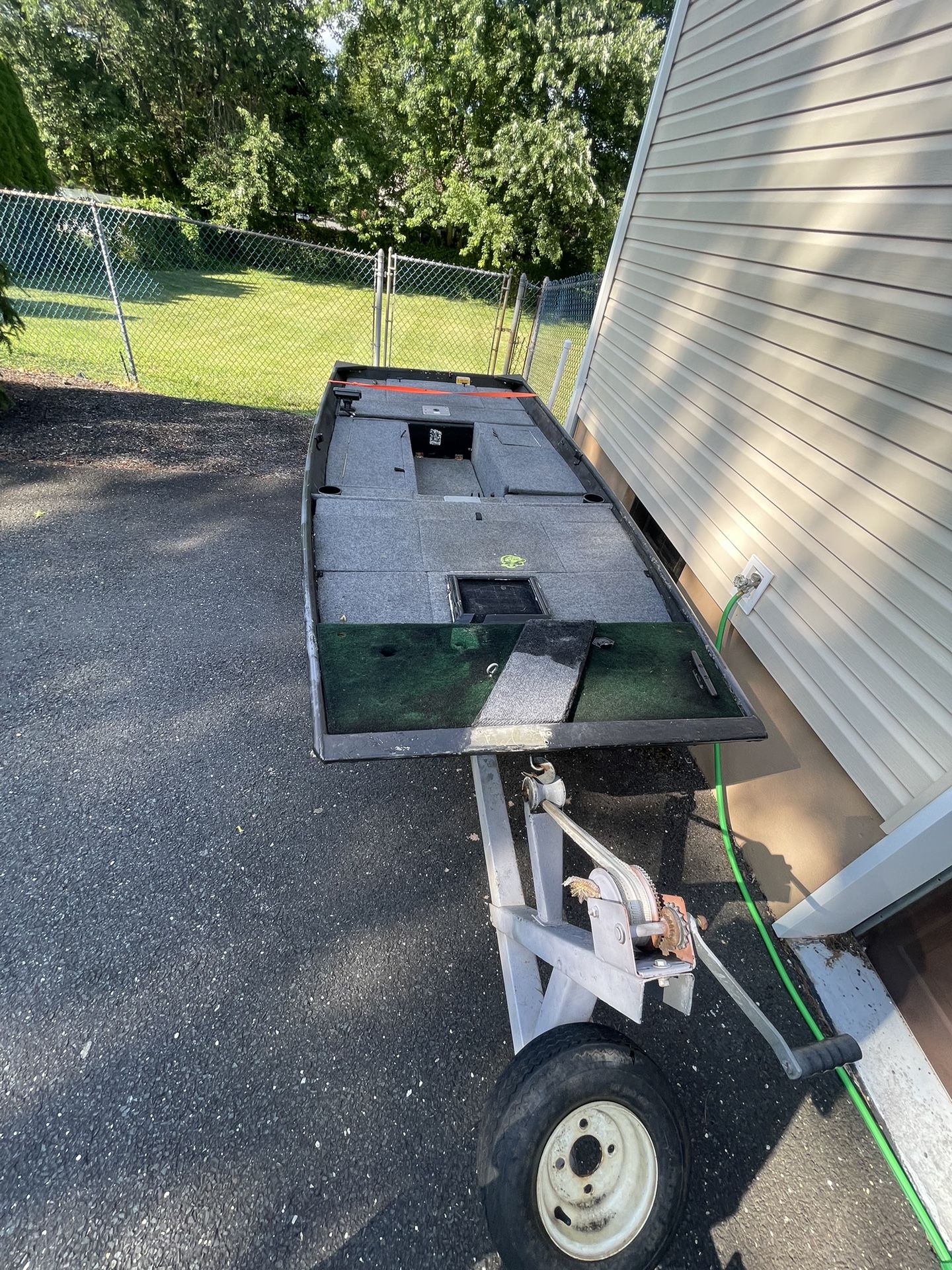 12’ aluminum Lowes boat with two batteries, a 55 lb thrust trolling motor, a Lowrence fish finder and trailer