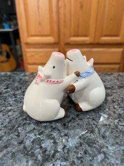 Vintage Ceramic Hugging Pigs Pair of Salt Pepper Shakers.  Brand OCI Omnibus.  Preowned missing stoppers.  Has been on display in a cabinet with a ver