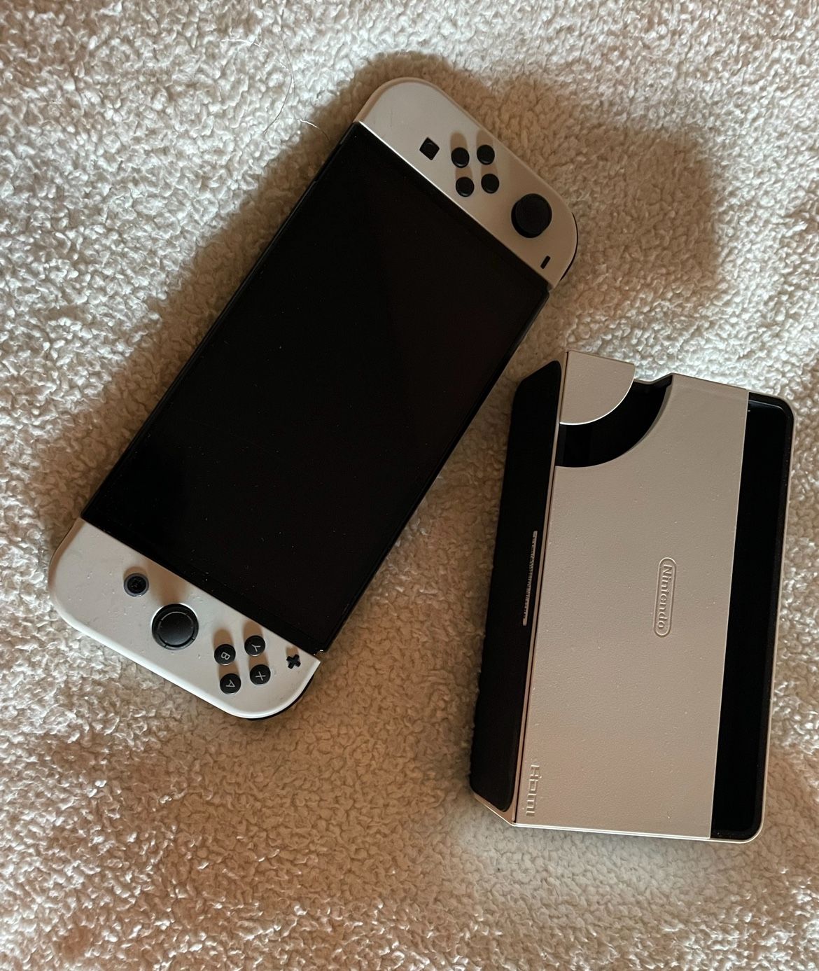 white nintendo switch OLED with doc 