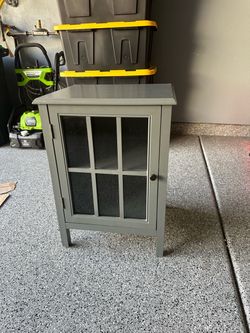 Gray cabinet with glass door