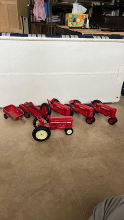 Vintage ERTL International red tractors and accessories