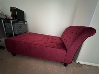 Burgundy chaise with small sham