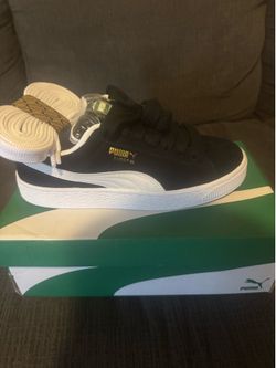 Black and white suede skater pumas