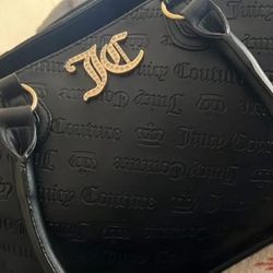 black Juicy Couture tote bag with gold accents and an embossed logo pattern