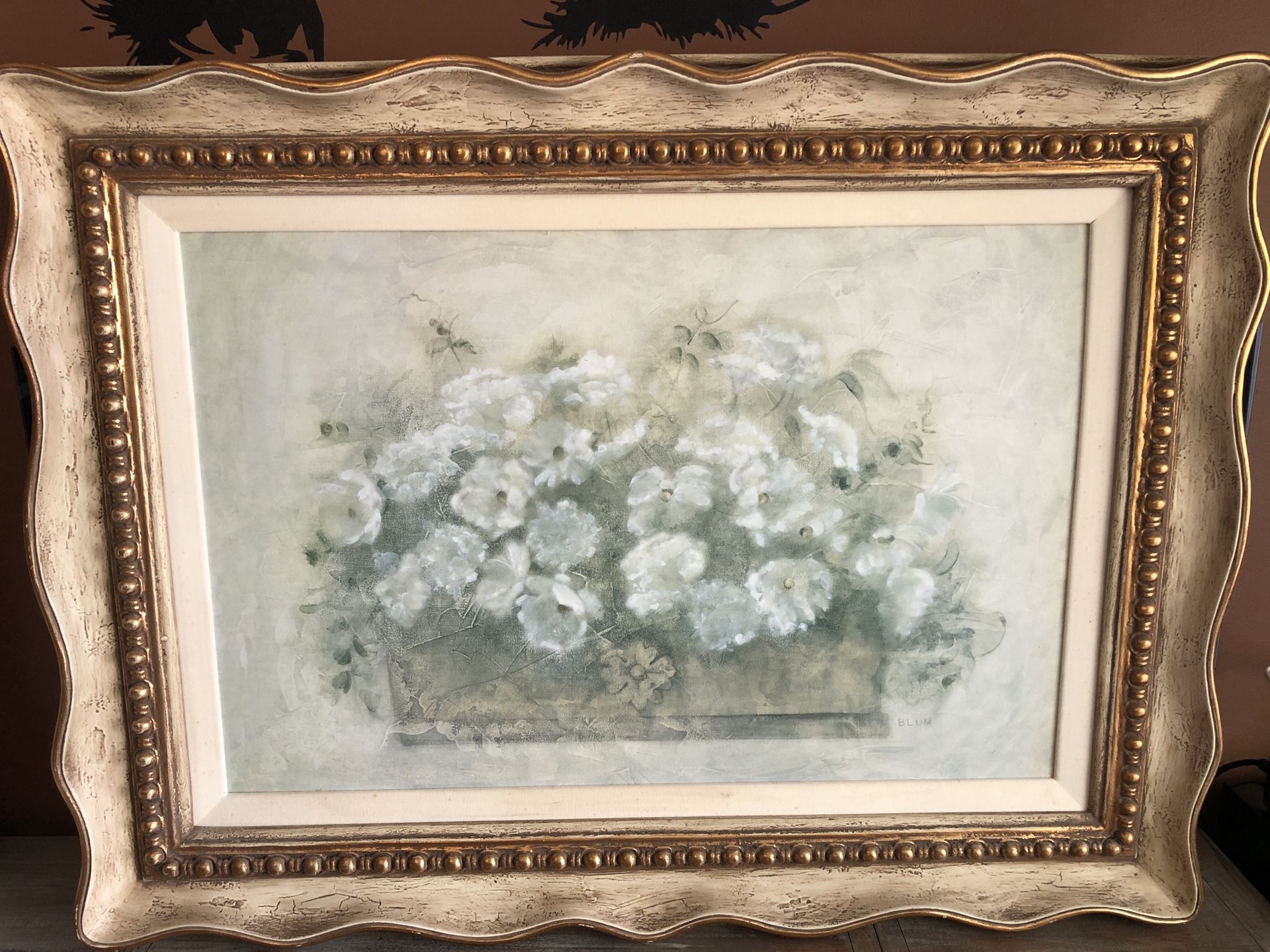 Floral painting in a golden frame