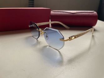 Blue lens Cartier glasses