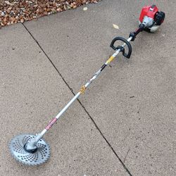 Massive cutting power! Great for ditches or arborvites or your neighbors overgrown yard! RedMax BCZ230TS gas-powered trimmer has a red engine housing