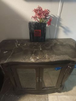 Wood cabinet with glass shelves and doors
