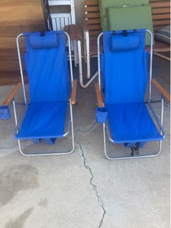 Beach chairs umbrella and wind stopper