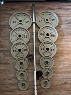 TITAN OLYMPIC WEIGHTS WITH 7 Ft 45 lb barbell 2x45, 2x35, 2x25, 2x10, 2x5 and 2x2.5 lbs with collar locks included