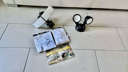 2 electric wall lights with motion sensor both $46