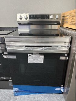 Electric Range New but with dented sides