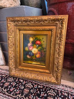 The work is a 20th-century floral still-life oil painting in the traditional Dutch style, featuring a vibrant bouquet of flowers against a dark backgr
