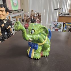 Ceramic Smiling Elephant Watering Pot Green Glaze Finish W/Blue Ribbon Signed Carolyn On Bottom 7.5"Hx9"W