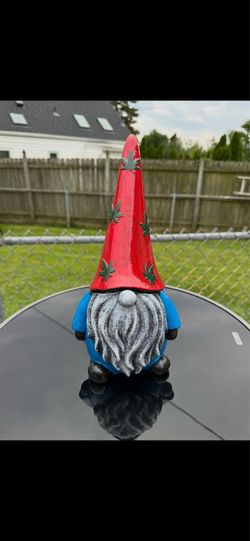 The red white blue and green gnome statue