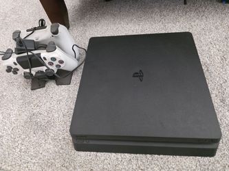 PS4 slim console with 2 controllers and charger