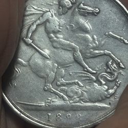 Collection coin of 1 silver crown from the United Kingdom, minted during the reign of Queen Victoria in 1899.  Design: The reverse shows St. George ki