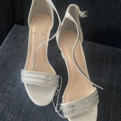 Women's silver heels, size 7.5, new
