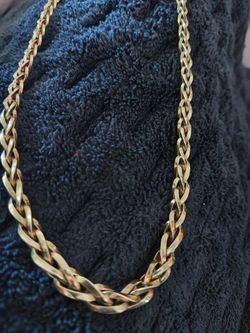 I have a 14 karat yellow gold  Necklace stamped Italy braided front larger braided towards the back smaller good claps on it