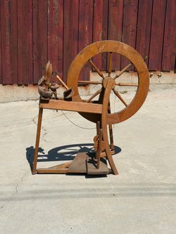 antique wooden spinning wheel