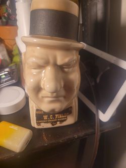 This vintage W.C. Fields Kentucky Straight Bourbon Whiskey decanter is a collectible item. 