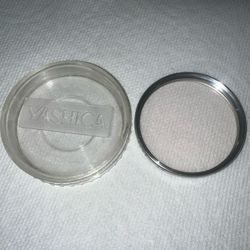Yashica 55mm Skylight 1A filter.