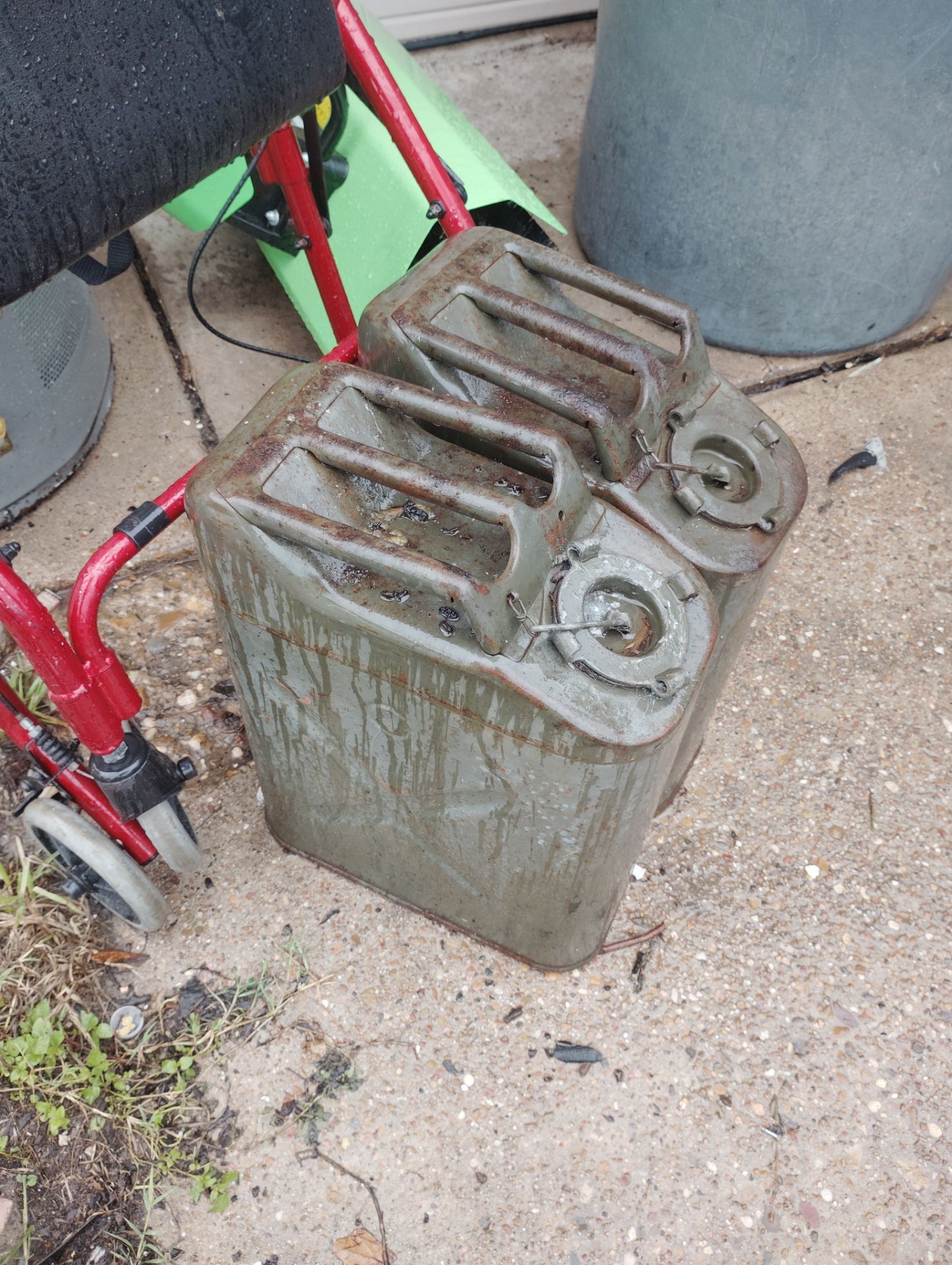 two old army metal gas tanks