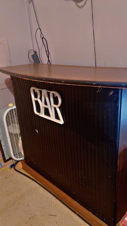 Small pop up bar with storage space behind the stand