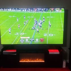 Samsung 85" TV Including Electrical Fire Place and Onn Surround Sound 5.1  System