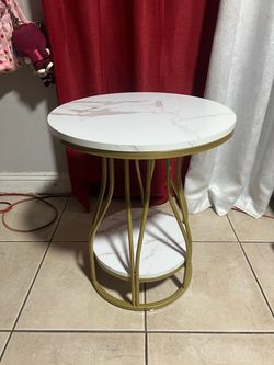 Round faux marble side table
