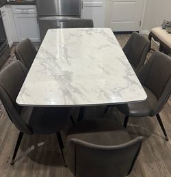 Dining table and set of 6 chairs