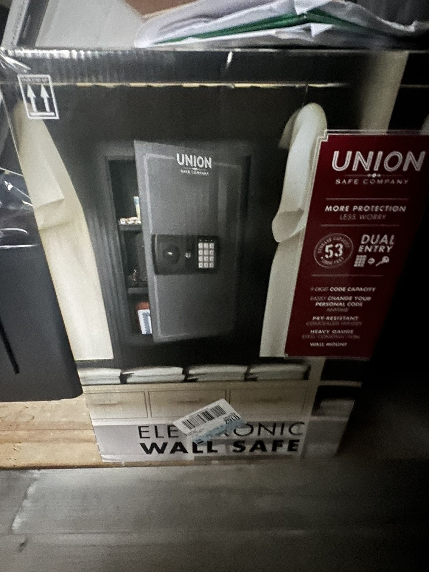 A wall safe and a gun cabinet