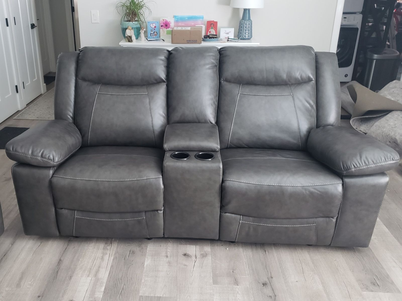 Gray Leather Power Reclining Sofa and Power Reclining Loveseat.