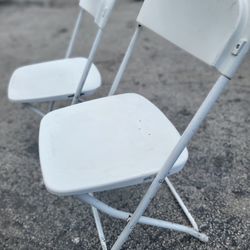 Used white folding chairs s,a,l, e