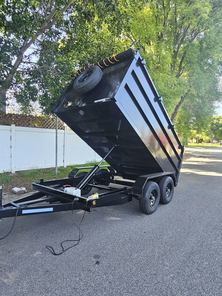 BRAND NEW DUMP TRAILER 8X12X4 12,000 LBS ROLLING TARP AND SPARE TIRE HYDRAULIC SYSTEM ELECTRIC BRAKES TITLE IN HAND FOR ANY QUESTION TEXT ME PLEASE