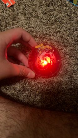 A lighting blue and red Batman bouncy ball