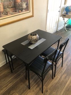 Black dining table set with 2 leather chairs and a Bench