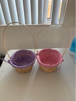 Spritz brand natural wood woven baskets featuring pink and purple gingham fabric liners