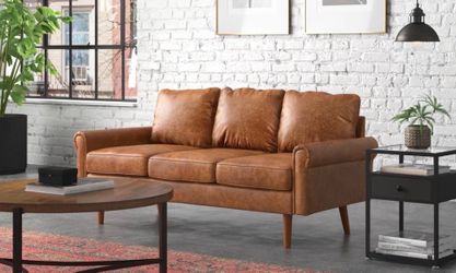 Brown faux leather sofa