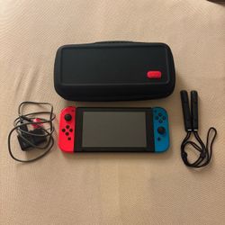 Nintendo Switch with Neon Joy-Cons and Accessories