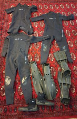 3x NeoSport wetsuits(2 XL) (1 2XL) with boots & 2 pair fins