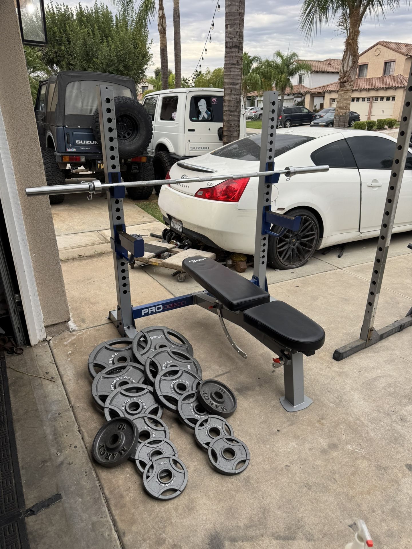 Bench press/squat rack with 270lbs of Olympic weights and 7ft 45lbs bar firm price