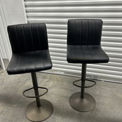 Two 30-46 in. H Adjustable Black Faux Leather Swivel Bar Stool