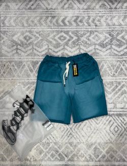 Godspeed shorts in a teal blue color.