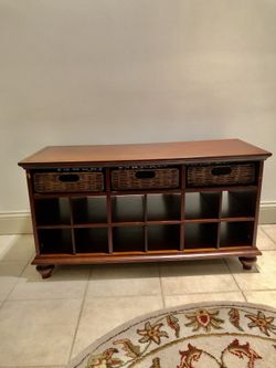 Stand with wicker basket storage