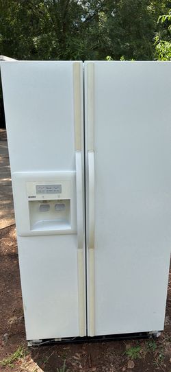 Kenmore side by side refrigerator/freezer with ice /water dispenser. Used. Good condition