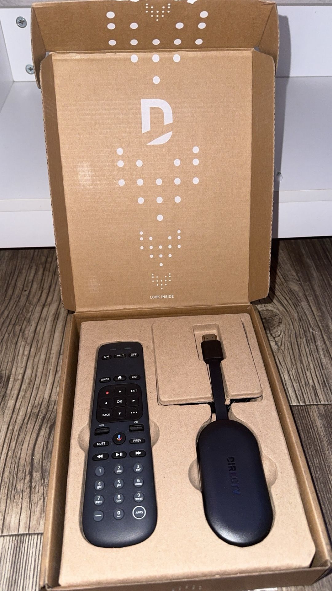 DIRECTV Gemini Air Streaming Device and its accompanying remote control.