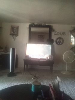 46 inch color tv black tv stand and black mirror made with real wood same as the tv stand real wood come with remote I got fire stick and the remote