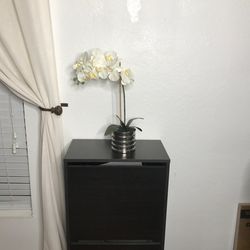 Single stem silk faux white orchid plant in silver pot.